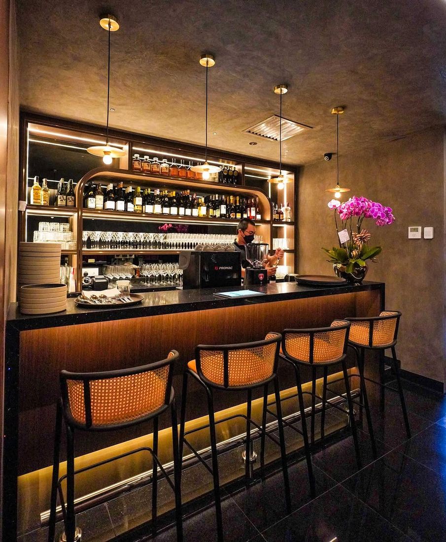 Chic Est cafe and bar with cane bar stools